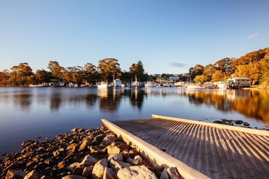 The idyllic setting across Wagonga Inlet at sunset in Narooma, NSW, Australia