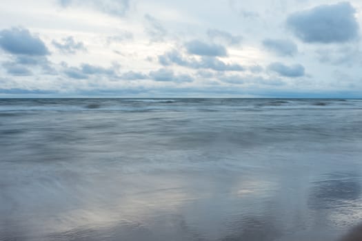 running clouds over the sea in the evening