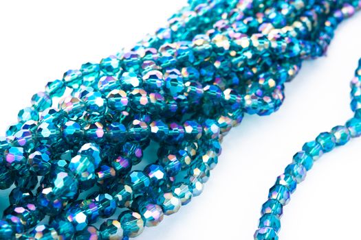 Beautiful emerald Glass Sparkle Crystal Isoalted Beads on white background. Use for diy beaded jewelry. Space for text