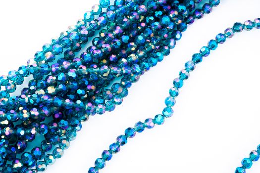 Beautiful emerald Glass Sparkle Crystal Isoalted Beads on white background. Use for diy beaded jewelry. Space for text