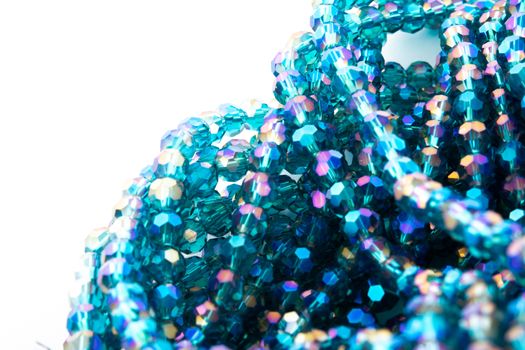 Beautiful emerald Glass Sparkle Crystal Isoalted Beads on white background. Use for diy beaded jewelry. Space for text