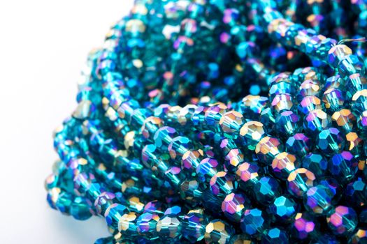 Beautiful emerald Glass Sparkle Crystal Isoalted Beads on white background. Use for diy beaded jewelry. Space for text