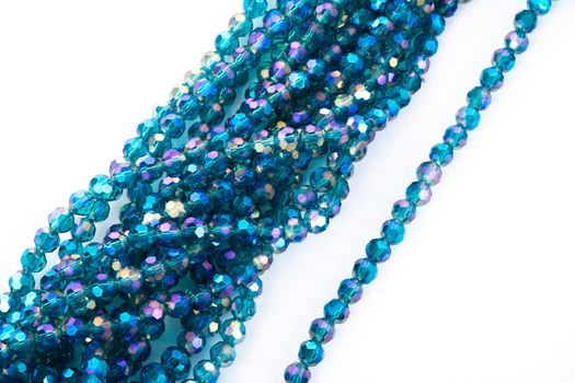 Beautiful emerald Glass Sparkle Crystal Isoalted Beads on white background. Use for diy beaded jewelry. Space for text