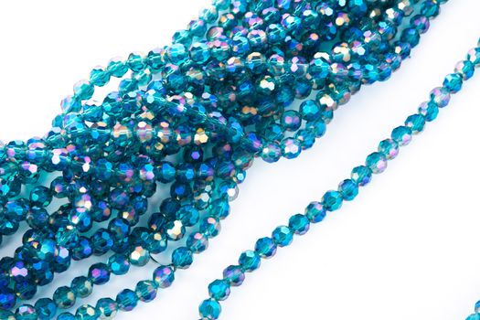 Beautiful emerald Glass Sparkle Crystal Isoalted Beads on white background. Use for diy beaded jewelry. Space for text