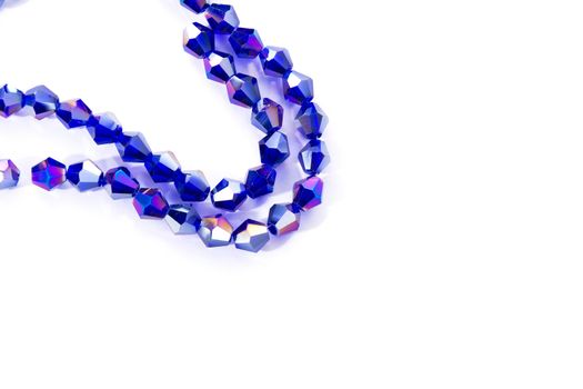 Beautiful blue Glass Sparkle Crystal Isoalted Beads on white background. Use for diy beaded jewelry. Space for text
