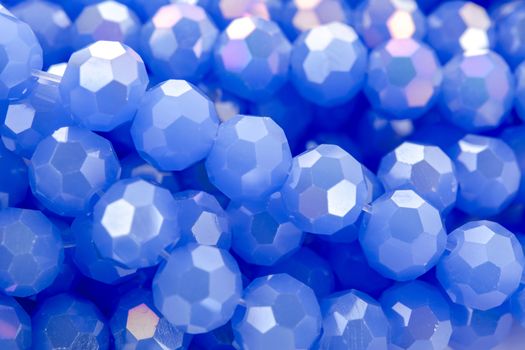 Beautiful blue Glass Sparkle Crystal Isoalted Beads on white background. Use for diy beaded jewelry. Space for text