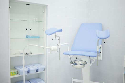 Gynecological chair in the hospital in the gynecologist's office. High quality photo
