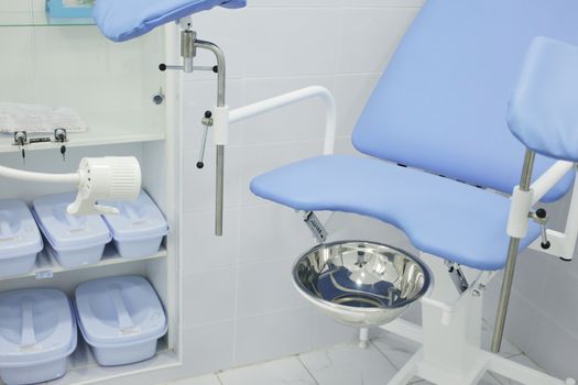 Gynecological chair in the hospital in the gynecologist's office. High quality photo