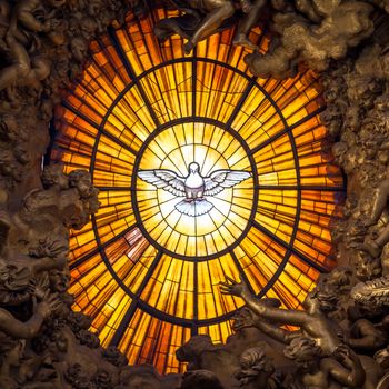 ROME, ITALY - AUGUST 24, 2018: Throne Bernini Holy Spirit Dove Saint Peter's Basilica Vatican Rome Italy. Bernini created Saint Peter's Throne with Holy Spirit Dove Stained Glass Amber in 1600s