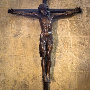 Old Italian crucifix, made of wood, with Jesus Christ symbol of resurrection and salvation