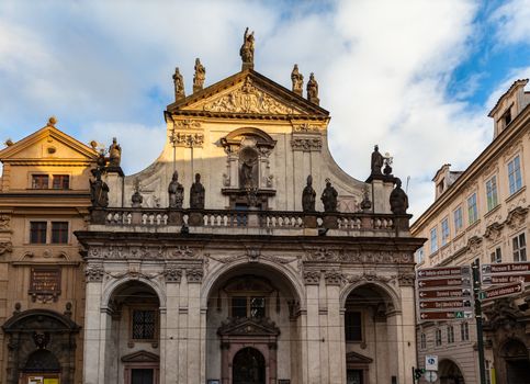 Close up view of St. Salvator Church close to Charles Bridge over Vltava river, one of two churches in the Klementinum in old town of Prague, Czech Republic