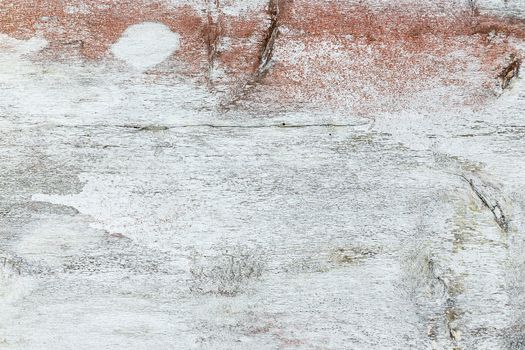 Close-up of an old wooden wall with weathered paint. Copy space.