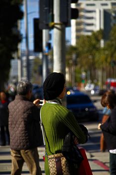 Santa Monica,CA/USA - Nov 23,2018 : People are waiting for the bus at the bus stop. Representatives of different nationalities live in United State of America.