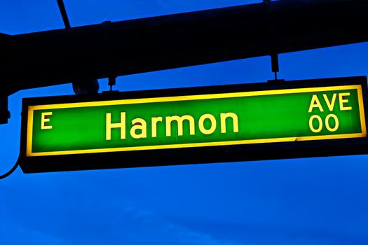 Road sign of Harmon Avenue.Street sign of Harmon Avenue.Green Harmon Avenue Sign with blue sky Background.