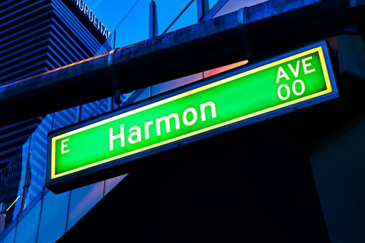Road sign of Harmon Avenue.Street sign of Harmon Avenue.Green Harmon Avenue Sign with blue sky Background.