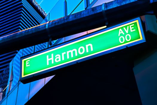 Road sign of Harmon Avenue.Street sign of Harmon Avenue.Green Harmon Avenue Sign with blue sky Background.