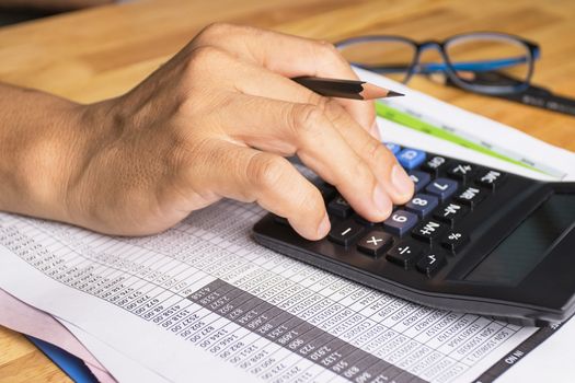 Hand of man use calculators concept Calculating expenses 