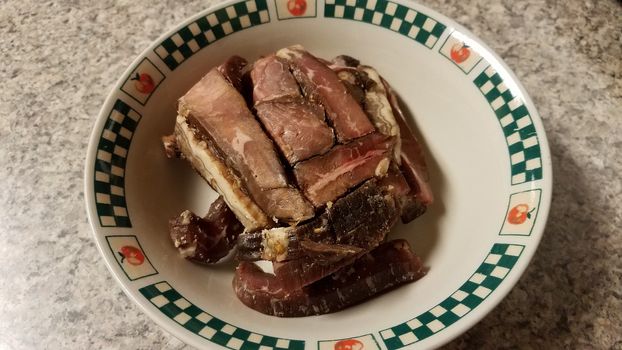 raw beef meat with fat in bowl on counter