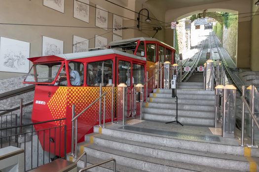 Upper city funicular line in Bergamo (Funicolare Citta Alta). Red funicular connects old Upper City and new. Bergamo (upper town), ITALY - August 19, 2020.