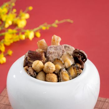 Traditional food of Chinese lunar new year, Buddha jumps over the wall, Chinese Soup Casserole dish, Buddha's Temptation, named Fo Tiao Qiang, close up.