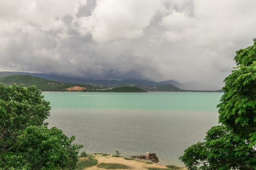 Koh Samui island in Surat Thani, Thailand. Turquoise water and gloomy storm clouds.