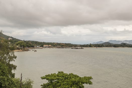 Koh Samui island in Surat Thani, Thailand. Turquoise water and gloomy storm clouds.