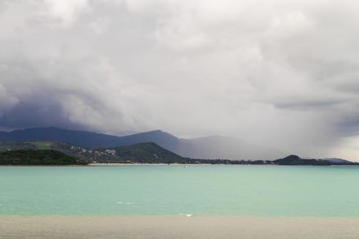 Koh Samui island in Surat Thani, Thailand. Turquoise water and gloomy storm clouds.