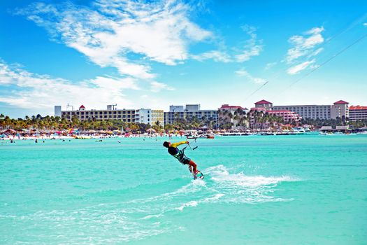 Kite surfing at Palm Beach on Aruba island in the Caribbean Sea