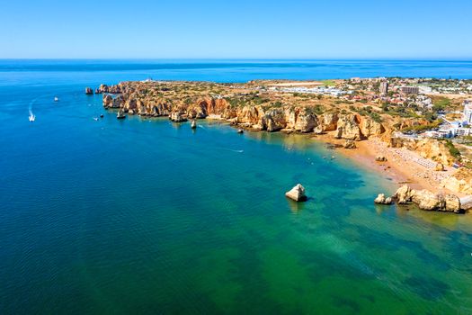 Aerial from Praia do Camillo on a rocky southcoast near Lagos in Portugal