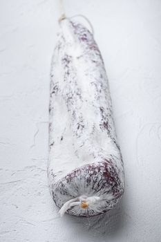 Longaniza spanish salami sausage on white background.