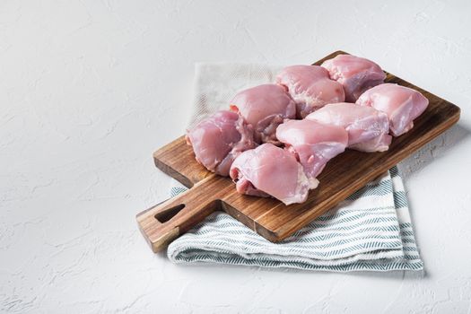 Raw chicken meat on white backgroundwith space for text.