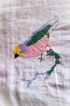 bird hand made embroidered smooth decoration on white fabric , vintage folk embroidery in Belarus, second half of 19 century