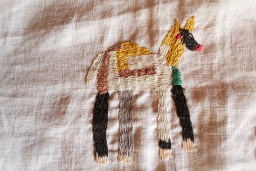 dog hand made embroidered smooth decoration on white fabric , vintage folk embroidery in Belarus, second half of 19 century