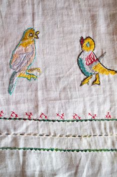 ornamental hand made embroidered smooth decoration on white fabric , vintage folk embroidery in Belarus, second half of 19 century