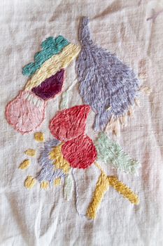 colorful hand made embroidered smooth decoration on white fabric , vintage folk embroidery in Belarus, second half of 19 century