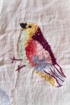 bird of paradise hand made embroidered smooth decoration on white fabric , vintage folk embroidery in Belarus, second half of 19 century