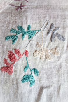 plant hand made embroidered smooth decoration on white fabric , vintage folk embroidery in Belarus, second half of 19 century
