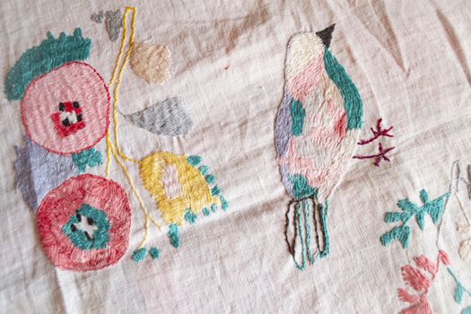 fragment hand made embroidered smooth decoration on white fabric , vintage folk embroidery in Belarus, second half of 19 century