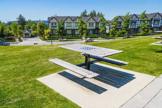 Recreation area with chess table on the block of new townhouses