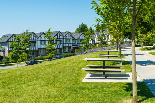 Recreation area with chess table on the block of new townhouses