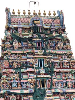 Temple with beautiful goupuram and sculptures in it with clear sky background