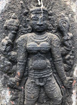 Ancient stone carvings of beautiful sculptures found in the temple in Tamilnadu. Beautiful bas-relief sculptures carved in the granite stone walls.