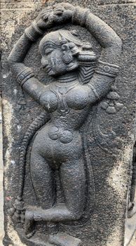 Ancient stone carvings of beautiful sculptures found in the temple in Tamilnadu. Beautiful bas-relief sculptures carved in the granite stone walls.