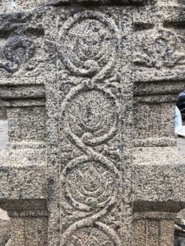Ancient stone carvings of beautiful sculptures found in the temple in Tamilnadu. Beautiful bas-relief sculptures carved in the granite stone walls.