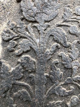 Ancient stone carvings of beautiful sculptures found in the temple in Tamilnadu. Beautiful bas-relief sculptures carved in the granite stone walls.