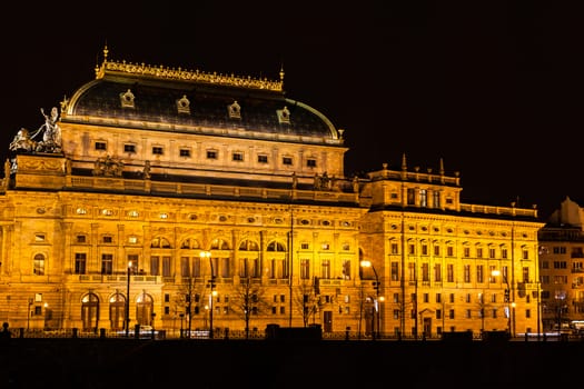Night view of  the National Theatre (Národní divadlo) with light illumination , located on the river side of Vltava River, Prague, Czech Republic