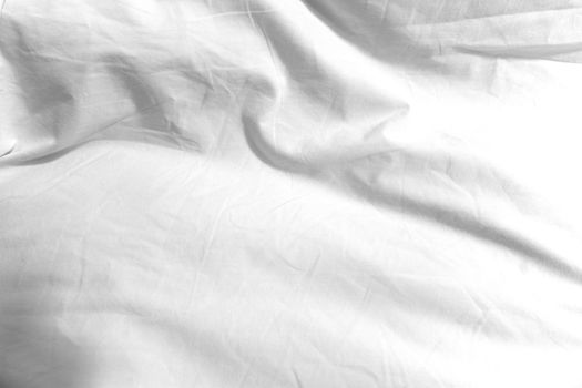 The surface wrinkles of the white bedding in the hotel