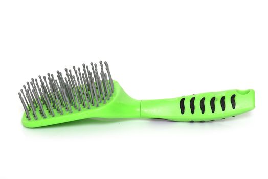 hair brush for horse in front of white background