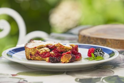 Redberry and blackberry shortcrust pastry slice of homemade Summer fruit pie.