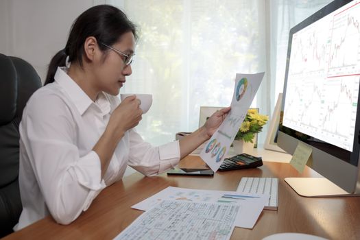Asian business women working at home online meeting with video conference on computer. Business people using computer online meeting and speaking with team group.